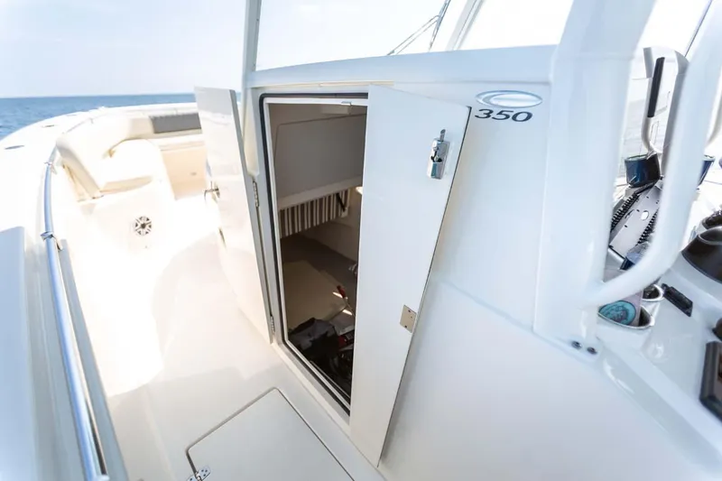 Slide: The Image of Manufacturer Provided Image: 2024 Cobia 350 Center Console boat interior storage compartment. - 6