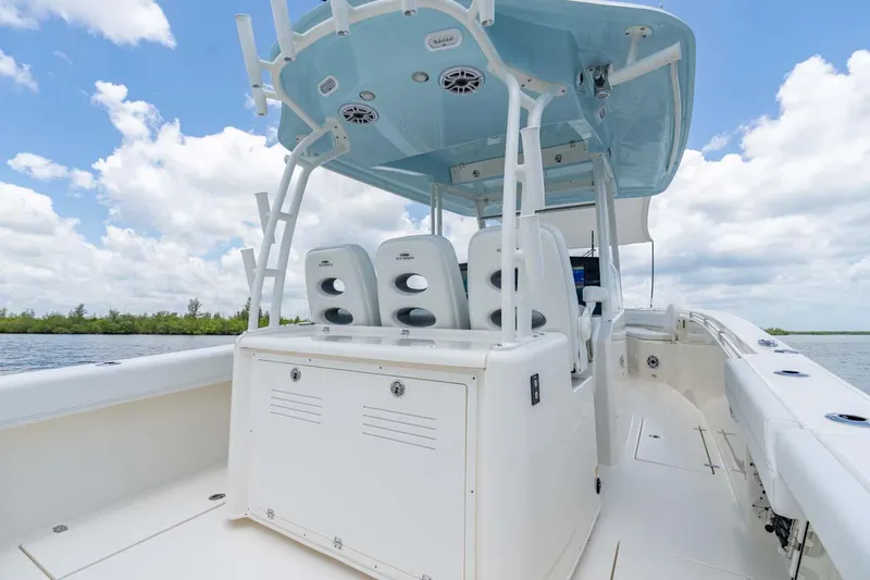 Slide: The Image of Manufacturer Provided Image: 2024 Cobia 350 Center Console boat interior with seating and overhead speakers. - 7