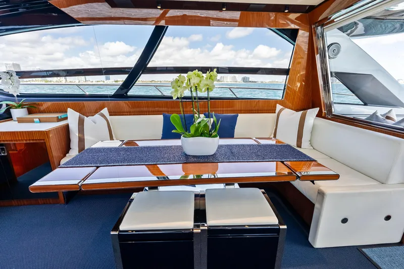 Slide: The Image of Luxurious interior of 2021 Riva 66' Ribelle yacht with elegant dining area and sea view. - 12