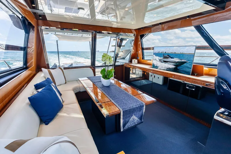 Slide: The Image of Luxurious interior of 2021 Riva 66' Ribelle yacht with elegant seating and ocean view. - 13