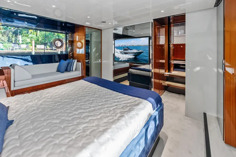 Slide: The Image of Luxurious interior of 2021 Riva 66' Ribelle yacht with elegant bedroom and seating area. - 17