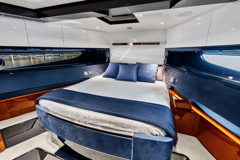 Slide: The Image of Luxurious cabin interior of 2021 Riva 66' Ribelle yacht with elegant bedding and modern design. - 19