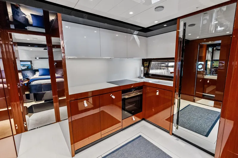 Slide: The Image of Luxurious kitchen interior of 2021 Riva 66' Ribelle yacht with modern cabinetry and appliances. - 23