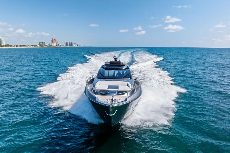 Slide: The Image of 2021 Riva 66' Ribelle yacht cruising on open ocean under clear blue sky. - 3