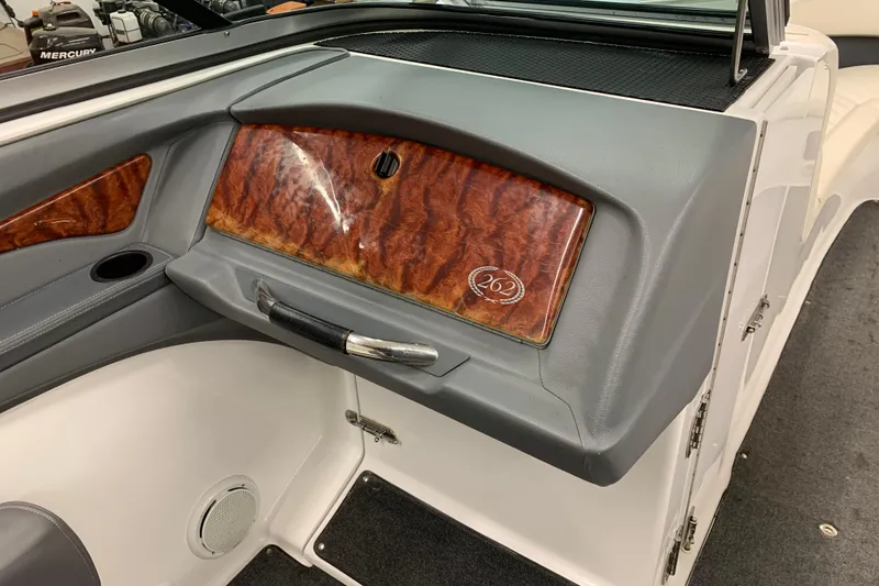 Slide: The Image of Interior of a 2007 Cobalt 262 boat featuring wood paneling and sleek design elements. - 11
