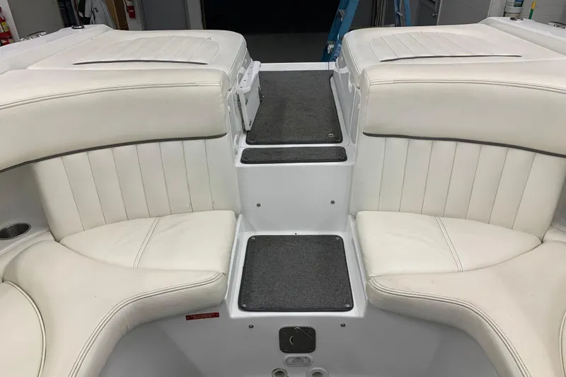 Slide: The Image of Interior of a 2007 Cobalt 262 boat with white cushioned seating. - 15