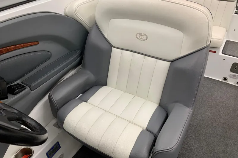 Slide: The Image of 2007 Cobalt 262 boat interior with gray and white leather seating. - 17