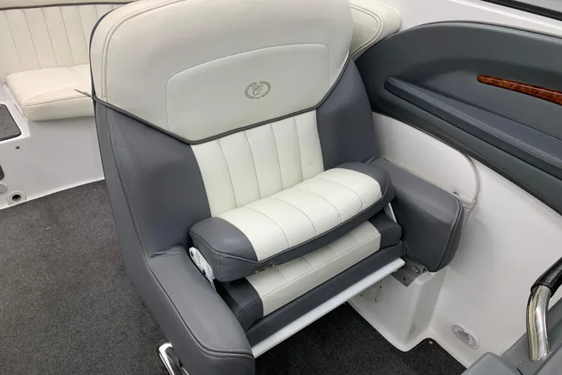 Slide: The Image of Captain's seat in a 2007 Cobalt 262 boat, featuring gray and white upholstery. - 18