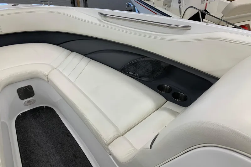 Slide: The Image of 2007 Cobalt 262 boat interior with white seating and cup holders. - 20