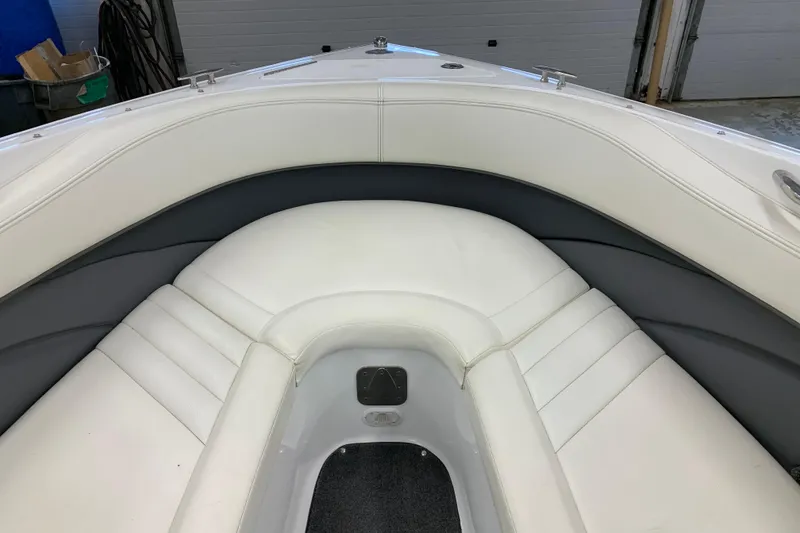 Slide: The Image of Interior of a 2007 Cobalt 262 boat with white and gray seating. - 21