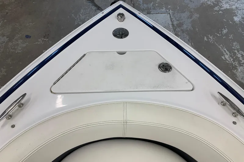 Slide: The Image of Bow of a 2007 Cobalt 262 boat with white seating and storage compartment. - 23