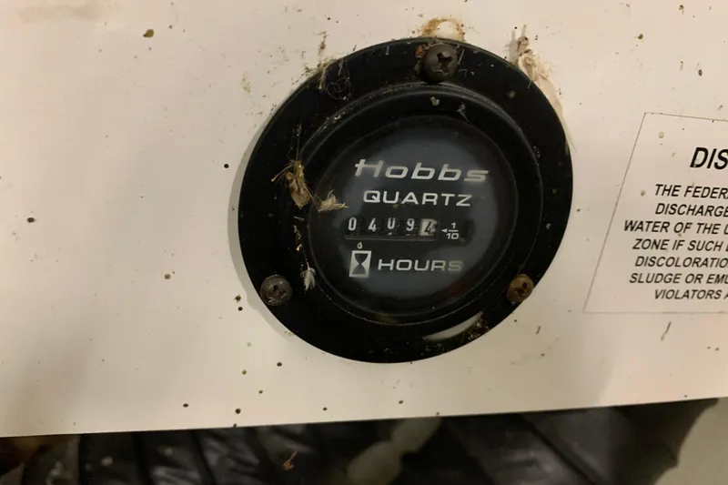 Slide: The Image of Hobbs quartz hour meter on 2007 Cobalt 262, displaying 4094.1 hours. - 27