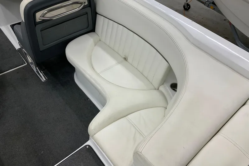 Slide: The Image of Interior seating of a 2007 Cobalt 262 boat with white upholstery and cup holder. - 4