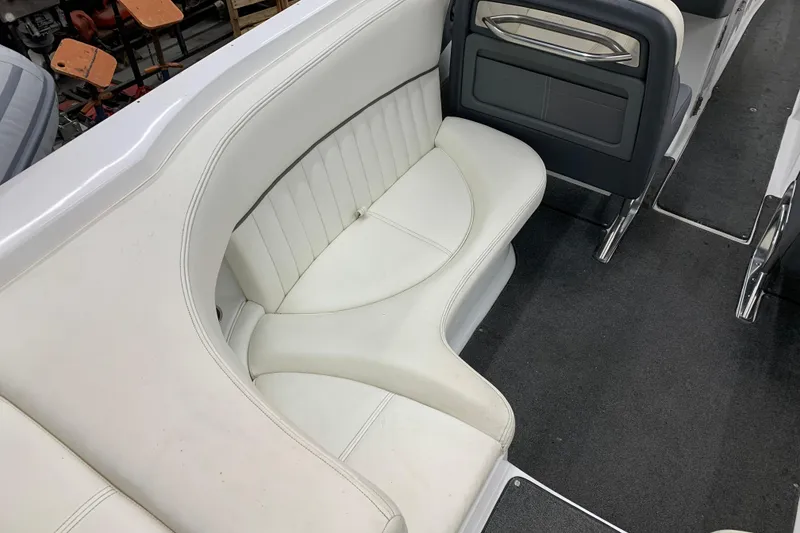 Slide: The Image of Interior seating of a 2007 Cobalt 262 boat, featuring white upholstery and sleek design. - 5