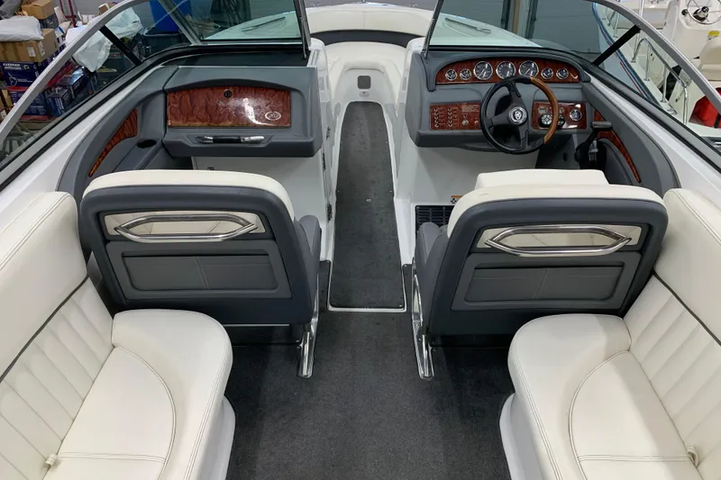 Slide: The Image of Interior of a 2007 Cobalt 262 boat with luxurious seating and sleek dashboard design. - 6