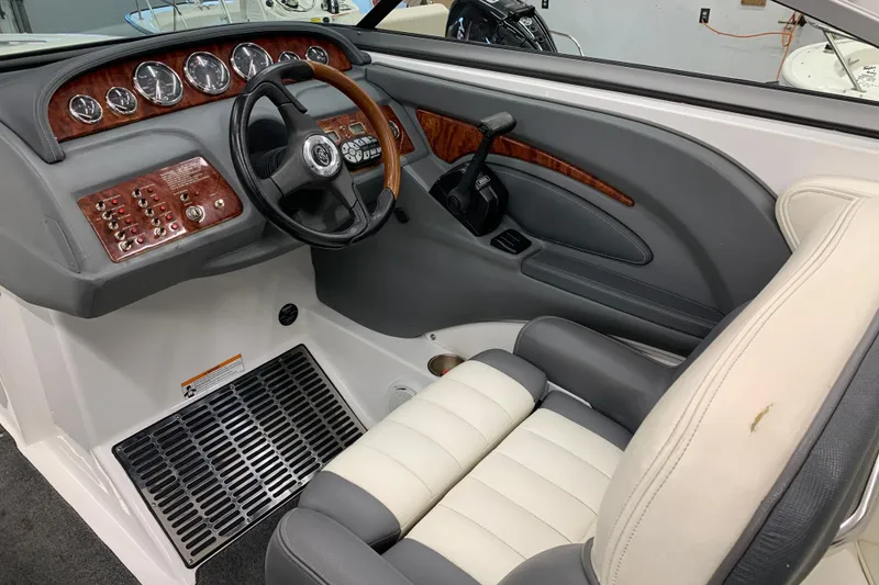 Slide: The Image of Interior of a 2007 Cobalt 262 boat, featuring a sleek dashboard and comfortable seating. - 7