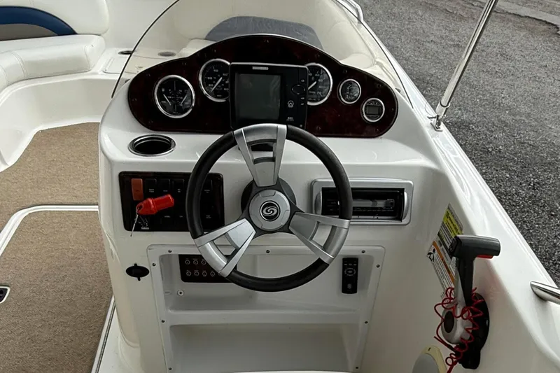 Slide: The Image of Steering console of 2013 Hurricane SunDeck Sport 201 OB boat with gauges and controls. - 6