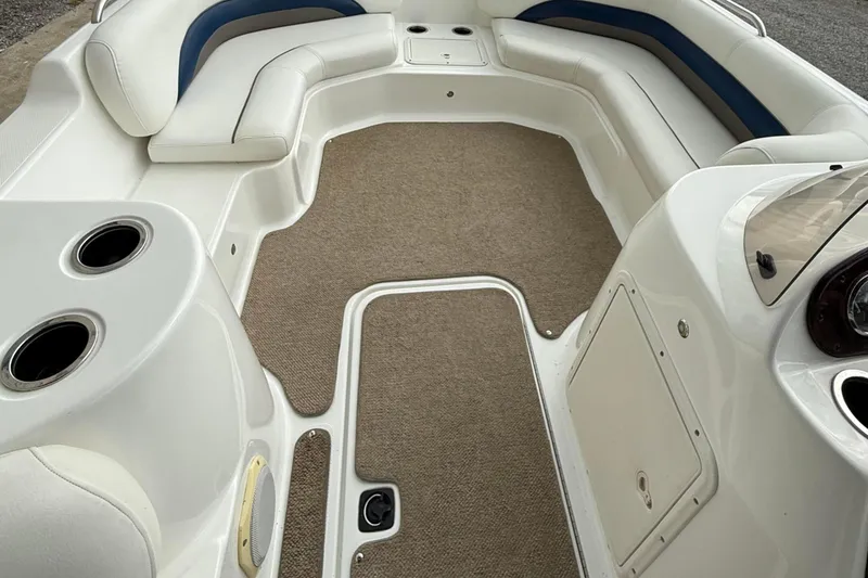 Slide: The Image of 2013 Hurricane SunDeck Sport 201 OB boat interior with spacious seating and cup holders. - 7