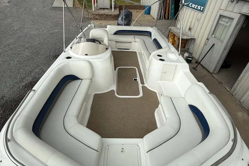 Slide: The Image of 2013 Hurricane SunDeck Sport 201 OB boat with spacious seating and clean interior. - 9