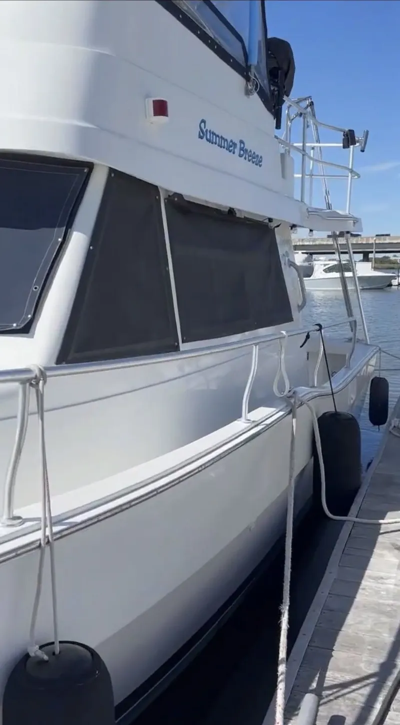 Slide: The Image of 2001 Mainship 390 Trawler docked, side view. - 11