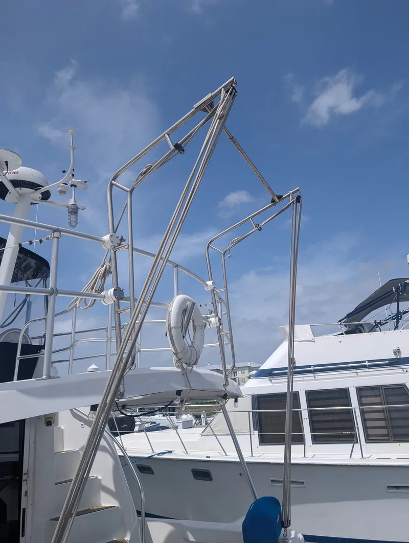 Slide: The Image of 2001 Mainship 390 Trawler with blue sky background. - 17