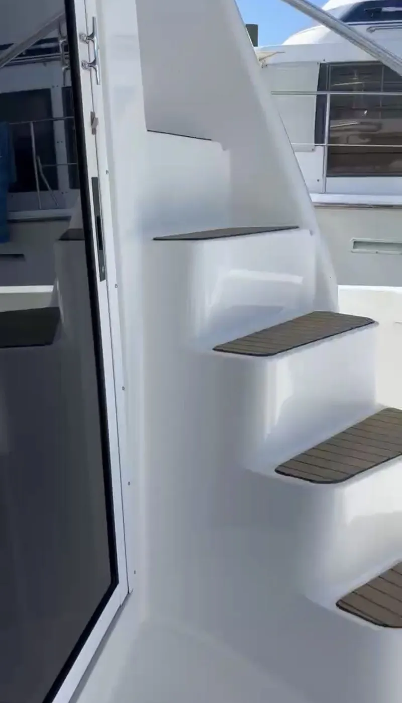 Slide: The Image of Staircase on a 2001 Mainship 390 Trawler boat. - 21