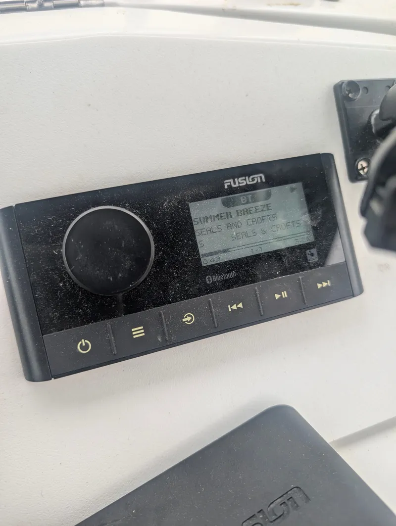 Slide: The Image of Fusion Bluetooth radio on Mainship 390 Trawler, playing 'Summer Breeze'. - 24