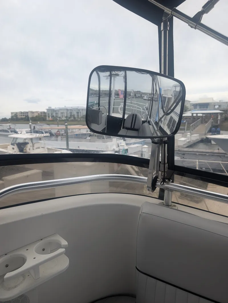 Slide: The Image of Rearview mirror on a 2001 Mainship 390 Trawler boat. - 25