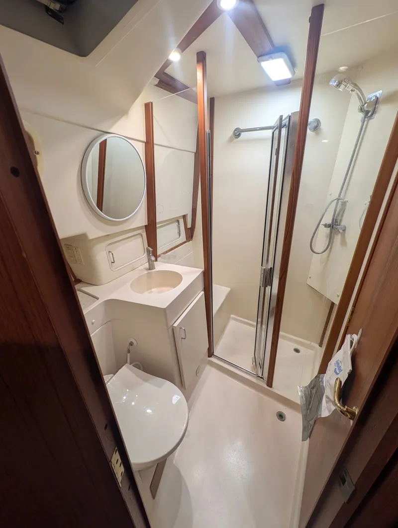 Slide: The Image of Bathroom in 2001 Mainship 390 Trawler with shower and sink. - 45