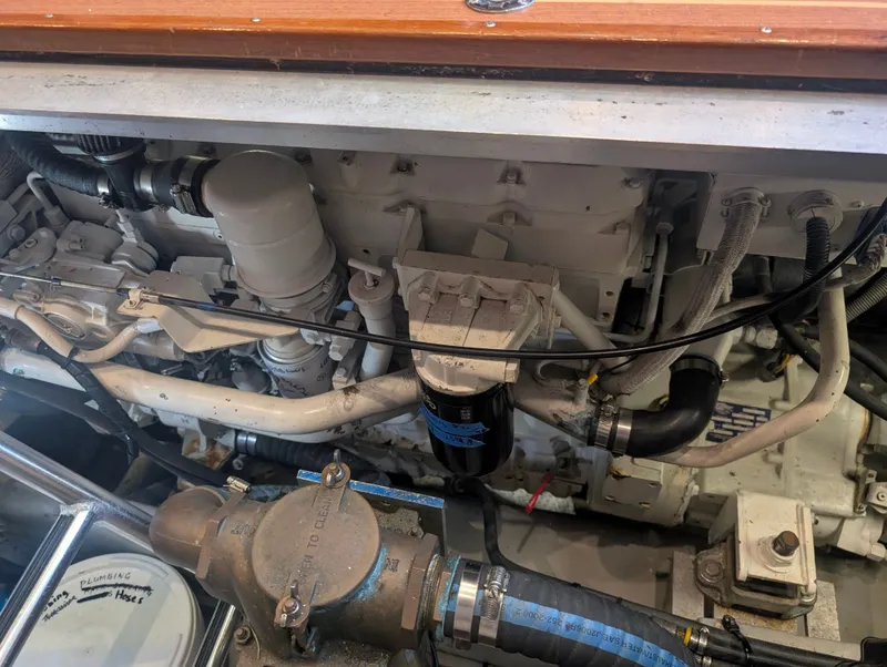 Slide: The Image of Engine compartment of a 2001 Mainship 390 Trawler with visible components. - 46
