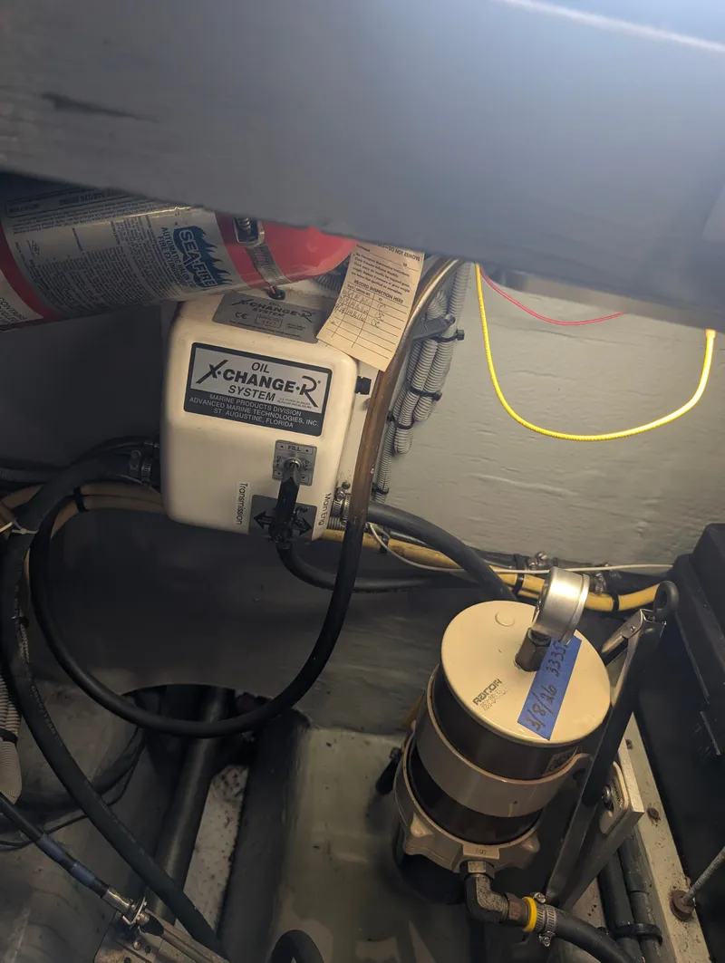 Slide: The Image of Oil change system in engine room of a 2001 Mainship 390 Trawler. - 65