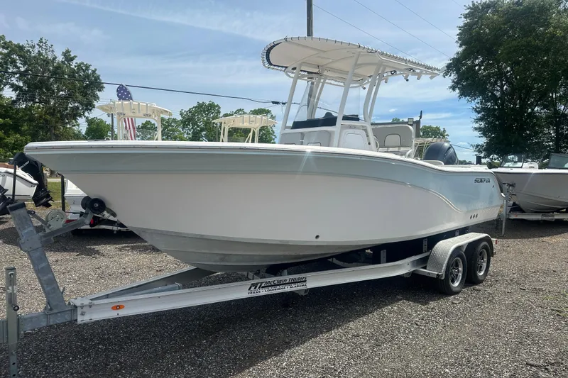 The Image of 2023 Sea Fox 228 Commander boat on trailer, parked outdoors. - 1