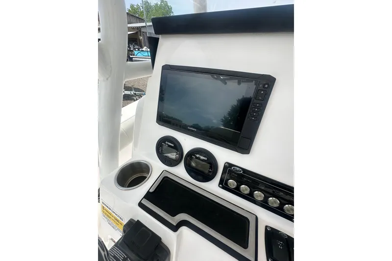 Slide: The Image of 2023 Sea Fox 228 Commander dashboard with Garmin display and controls. - 11