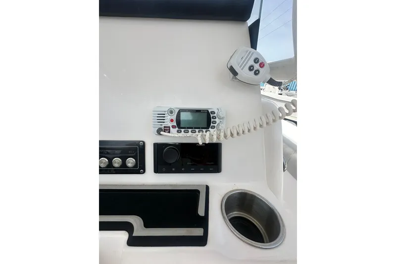 Slide: The Image of 2023 Sea Fox 228 Commander dashboard with radio and controls. - 12