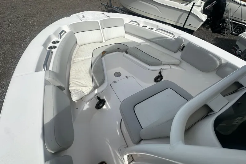 Slide: The Image of 2023 Sea Fox 228 Commander boat interior with cushioned seating and cup holders. - 14
