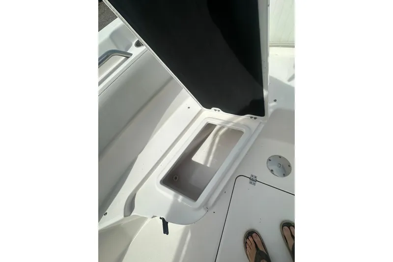 Slide: The Image of 2023 Sea Fox 228 Commander boat storage compartment with open hatch. - 19