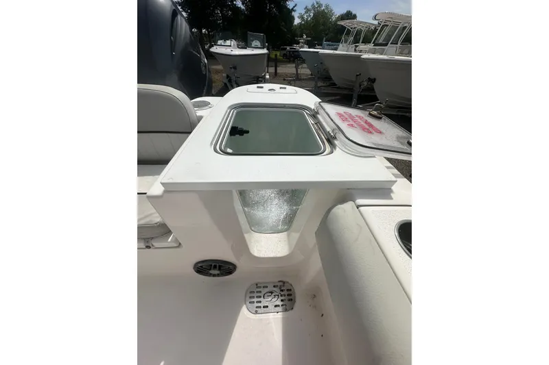 Slide: The Image of 2023 Sea Fox 228 Commander boat interior with open storage compartment. - 24