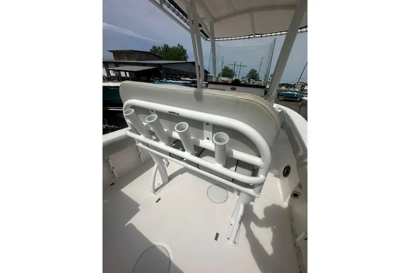 Slide: The Image of 2023 Sea Fox 228 Commander boat interior with rod holders and seating. - 25