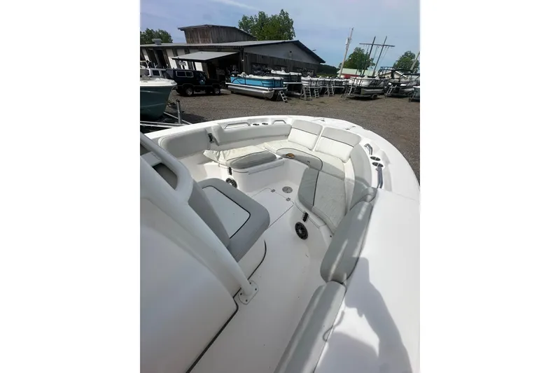 Slide: The Image of 2023 Sea Fox 228 Commander boat interior with white seating and storage compartments. - 27