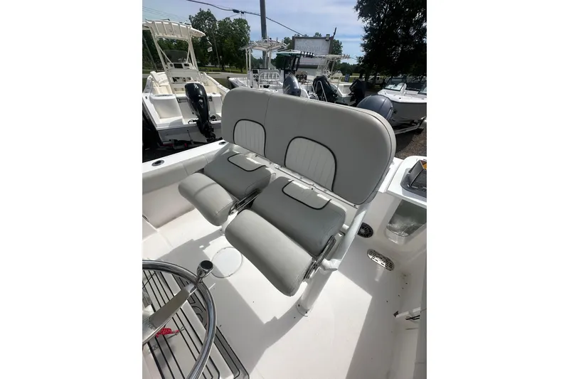 Slide: The Image of 2023 Sea Fox 228 Commander boat interior with dual seating and steering wheel. - 32