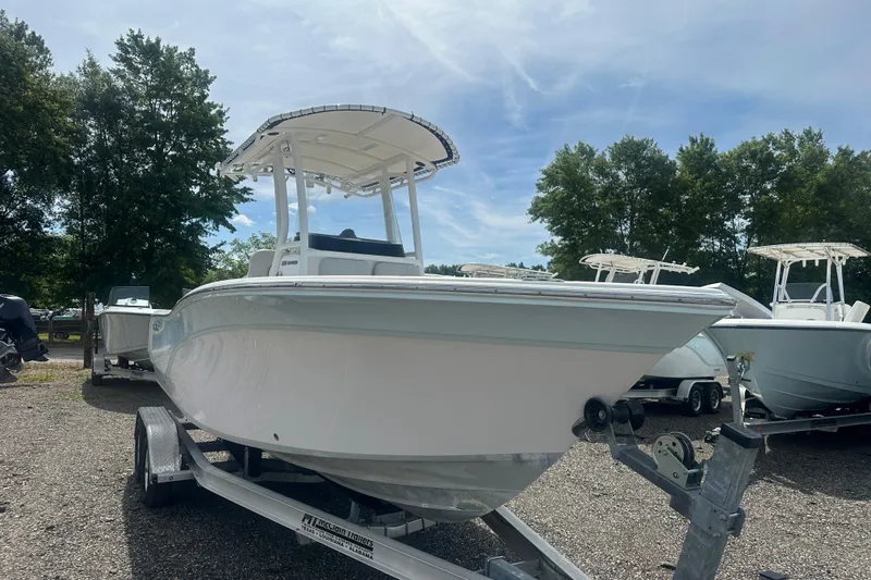 Slide: The Image of 2023 Sea Fox 228 Commander boat on trailer, parked outdoors under clear sky. - 8