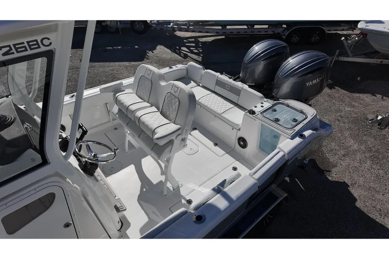 Slide: The Image of 2026 Sea Fox 268 Commander boat interior with dual Yamaha engines, featuring seating and steering area. - 13