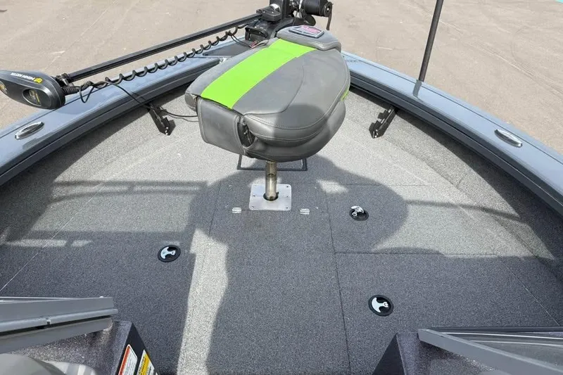 Slide: The Image of 2022 Ranger VX1888 WT boat interior with green-accented seat and trolling motor. - 14