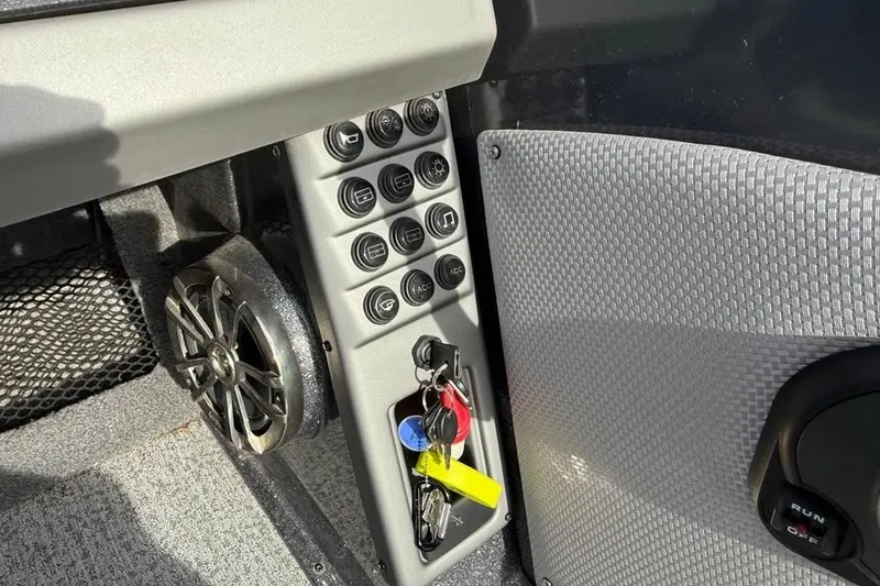 Slide: The Image of Control panel of 2022 Ranger VX1888 WT boat with keys and speaker. - 16