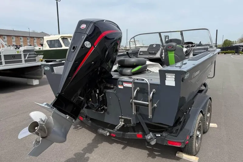 Slide: The Image of 2022 Ranger VX1888 WT boat with powerful outboard motor, parked on a trailer. - 5