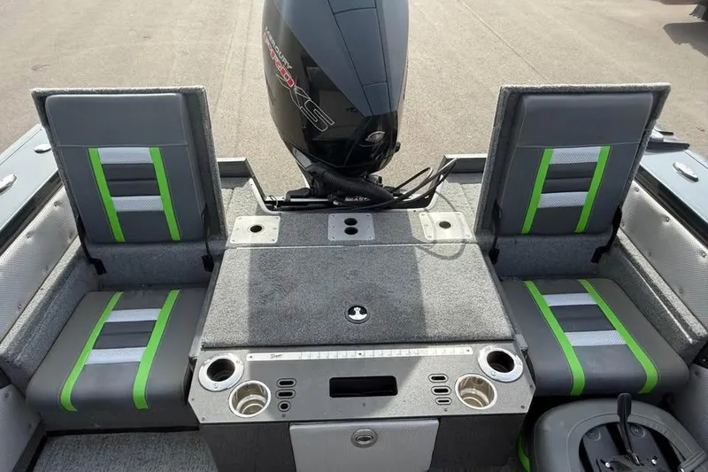 Slide: The Image of 2022 Ranger VX1888 WT boat interior with gray and green seating, featuring a powerful outboard motor. - 7