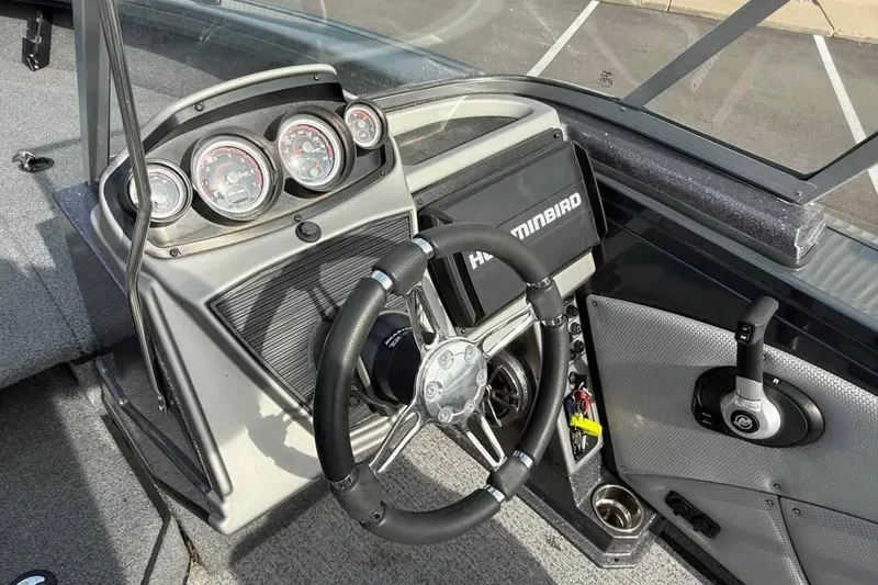 Slide: The Image of 2022 Ranger VX1888 WT boat dashboard with steering wheel and Humminbird display. - 9