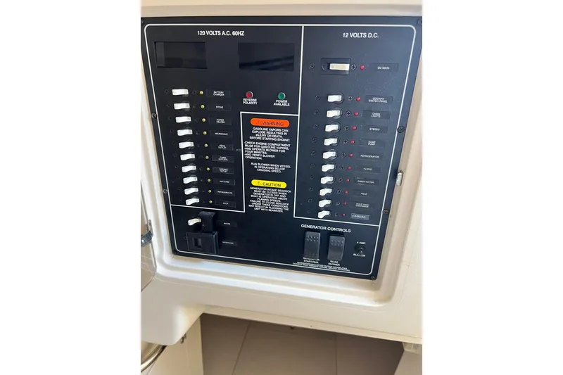 Slide: The Image of Electrical control panel on a 2004 Grady-White Express 330 boat. - 25