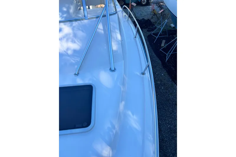Slide: The Image of 2004 Grady-White Express 330 boat deck with stainless steel railings. - 28