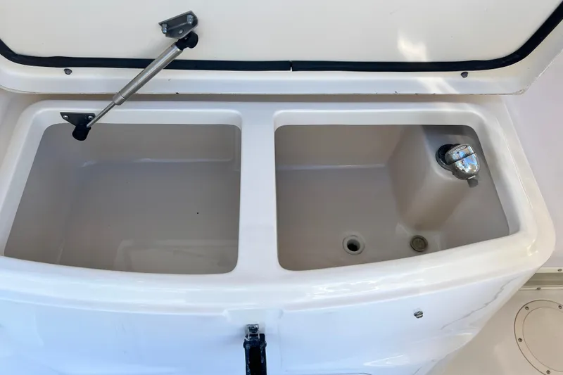 Slide: The Image of Open storage compartment on a 2004 Grady-White Express 330 boat. - 32
